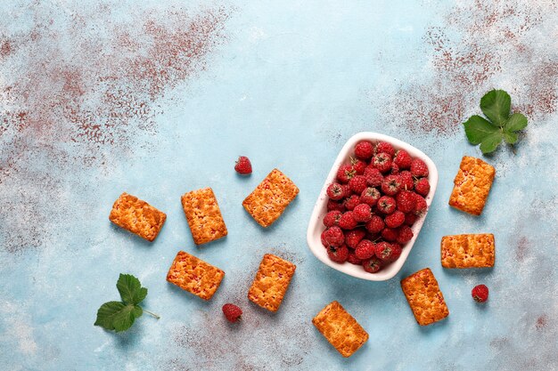 Sweet delicious raspberry jam cookies with ripe raspberries