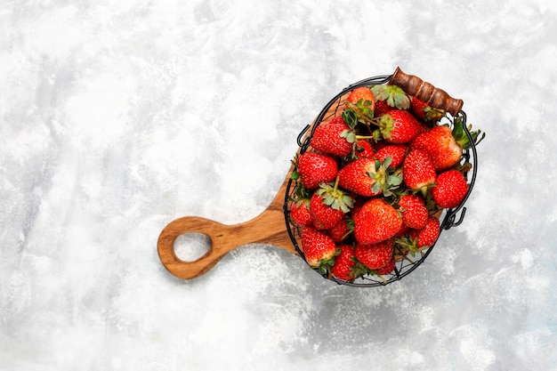 Sweet delicious strawberries in basket,top view