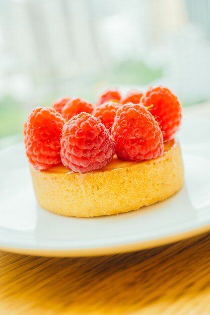 Sweet dessert custard tart with raspberry on top