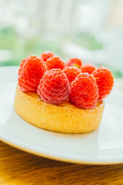 Sweet dessert custard tart with raspberry on top