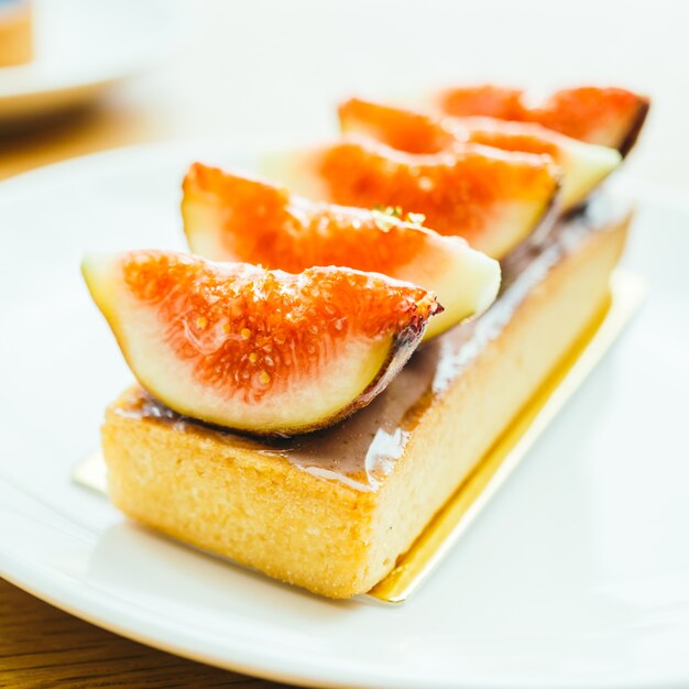 Sweet dessert with tart and fig on top