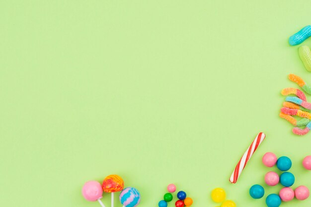 Sweet flavored candies spread on table