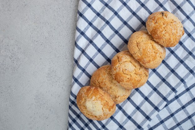 Sweet fresh round cookies on tablecloth