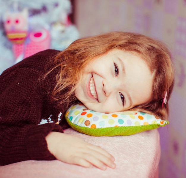 Sweet girl in beautiful christmas decorations.