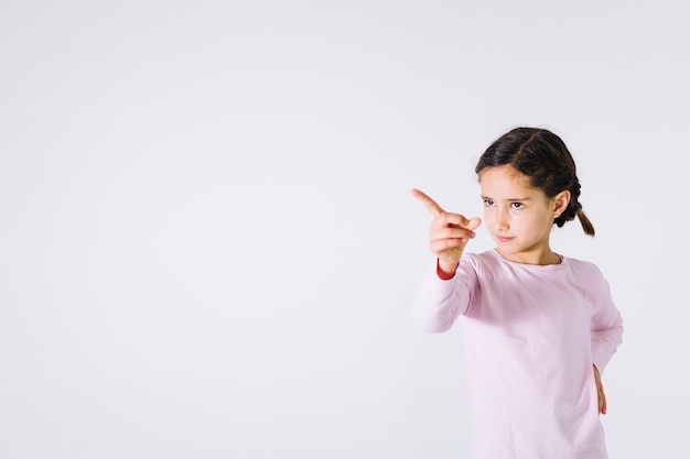 Sweet girl showing direction