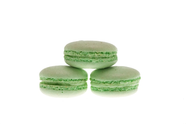 Sweet green macaroons isolated over white background. Tasty macaroon