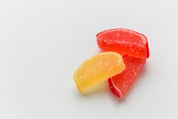 Sweet gummy fruit on whiter table