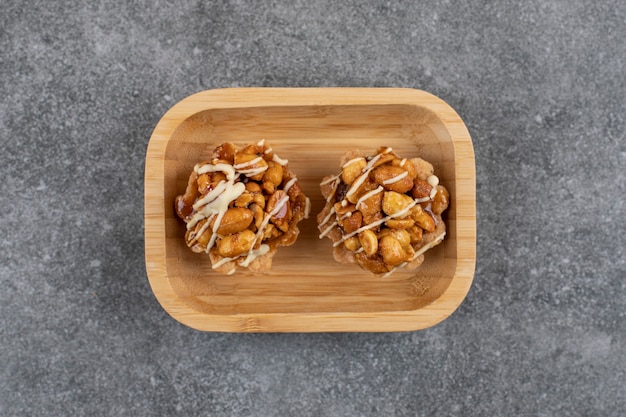 Sweet handmade fresh cookies on wooden bowl. 