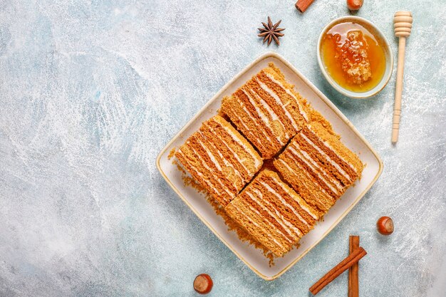 Sweet homemade layered honey cake with spices and nuts.