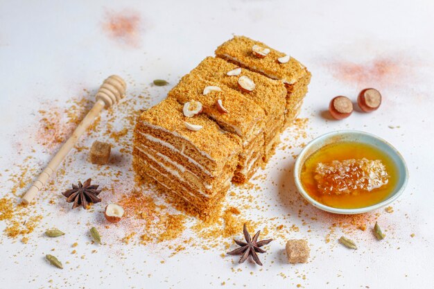 Sweet homemade layered honey cake with spices and nuts.