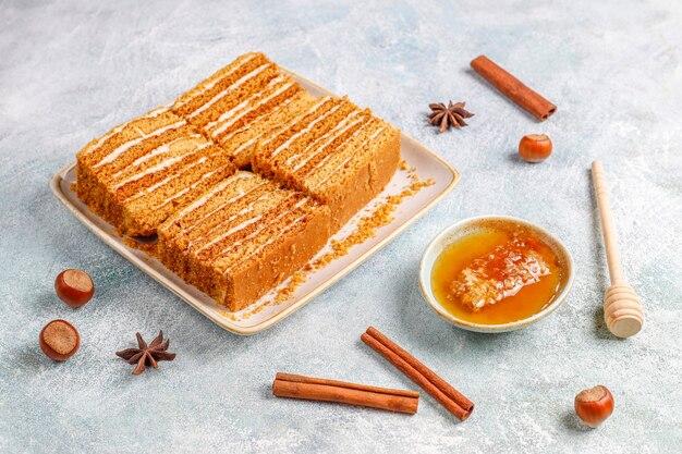 Sweet homemade layered honey cake with spices and nuts.