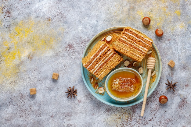 Free photo sweet homemade layered honey cake with spices and nuts.