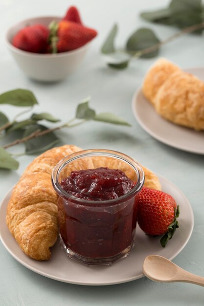 Sweet homemade natural strawberry jam and croissant