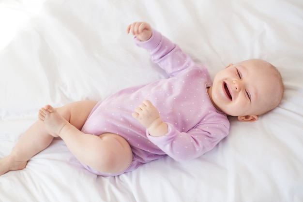 Sweet little girl on the bed