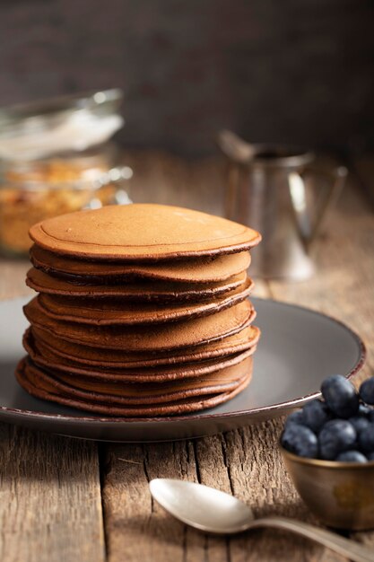 Sweet pancakes on plate with blueberries