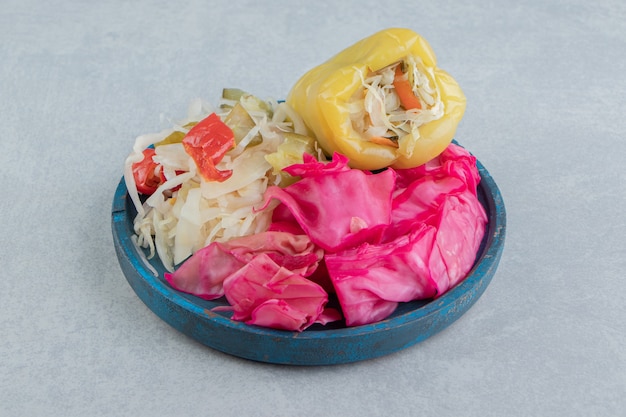Free photo sweet pepper, chopped green and red sauerkraut in a bowl