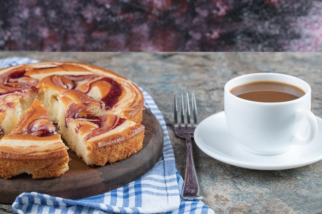 Sweet pie served with a cup of coffee.