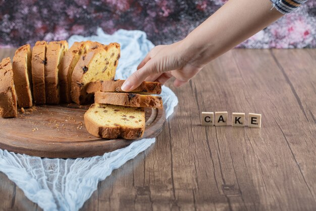 Sweet pie slices isolated on a wooden board.