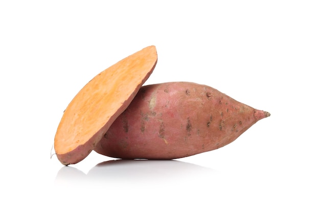 Sweet potatoes on a white surface