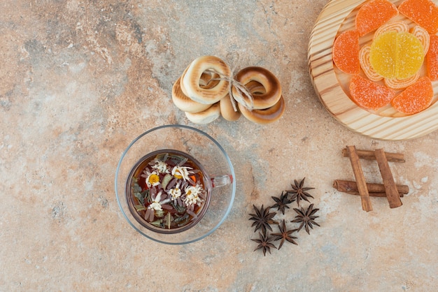 Sweet round cookies with herbal tea and marmalade