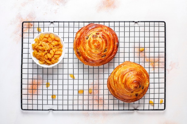 Free photo sweet round french buns with raisins.