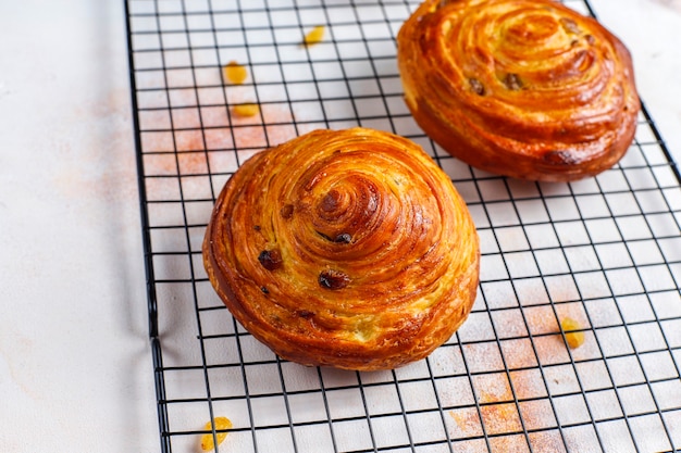 Sweet round french buns with raisins.