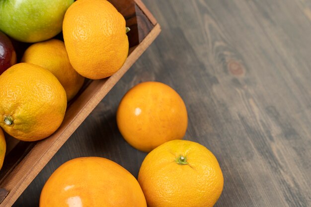 Sweet tangerines or mandarins on a wooden table. High quality photo