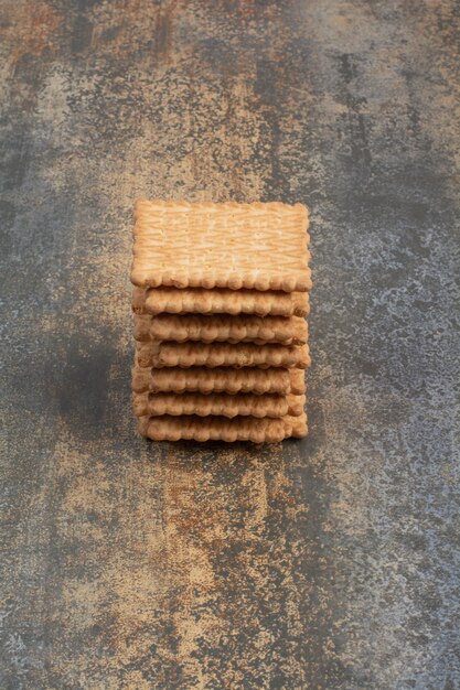 Sweet tasty crackers on marble background. High quality photo