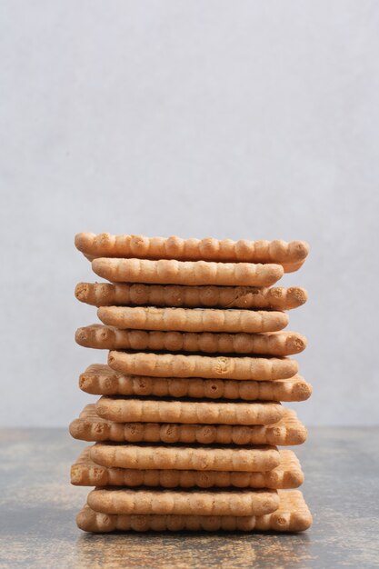 Sweet tasty crackers on marble background. High quality photo