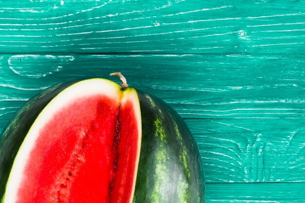 Sweet watermelon cut on green background