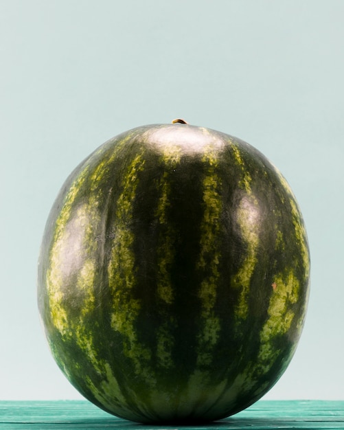 Sweet whole watermelon on blue background