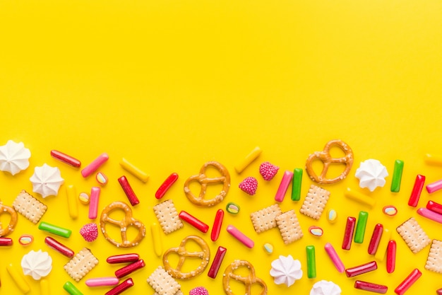 Free photo sweets flat lay on yellow background