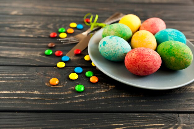 Sweets near plate with eggs