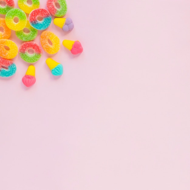 Sweets on pink surface