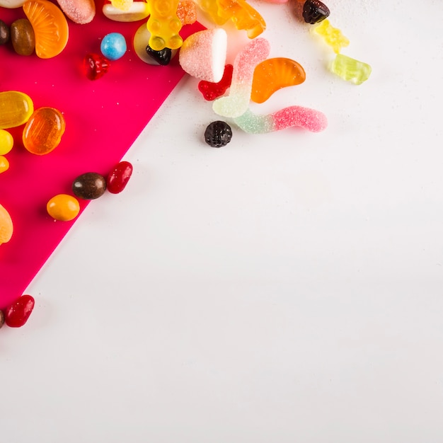 Sweets on white and fuchsia background