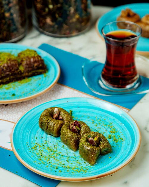 Sweets with pistachio and black tea