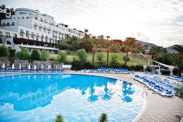 Swimming pool in morning at mediterranean summer resort hotel in Turkey Bodrum Reflection in water