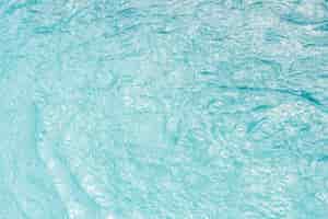 Free photo swimming pool water texture in sunlight background