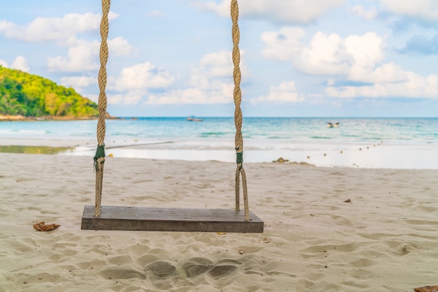 Free photo a swing on the beach