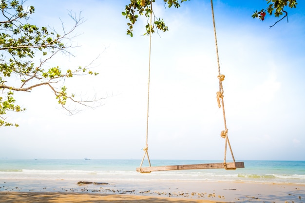 Free photo swing with sea background