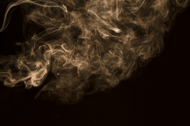 Swirling white fog on black background