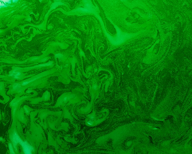 Free Photo swirls of foam on green colored liquid