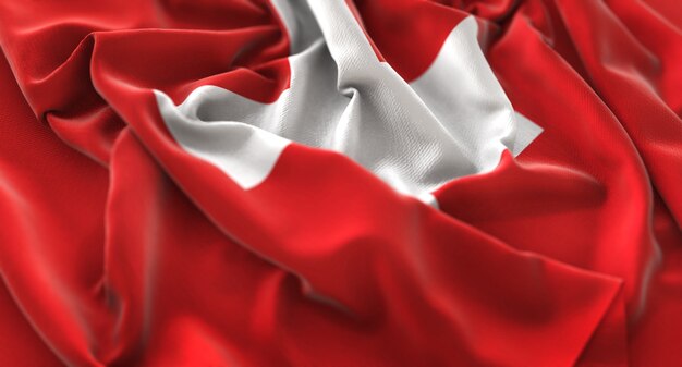 スイスの旗が美しく波打ち際に浮かび上がっているマクロのクローズアップショット