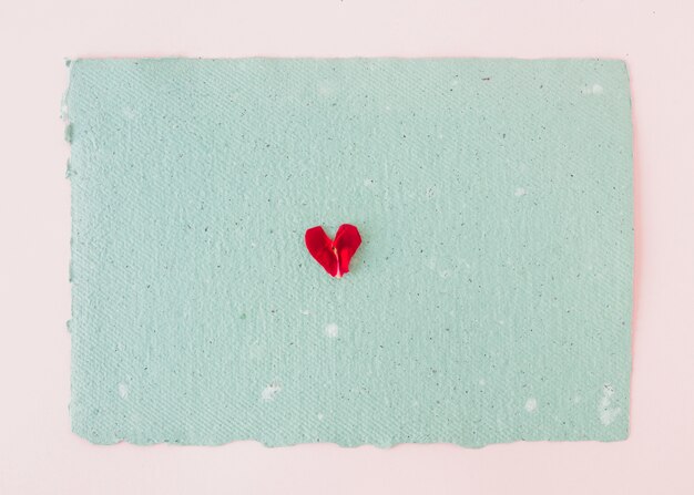 Symbol of heart on blue paper 