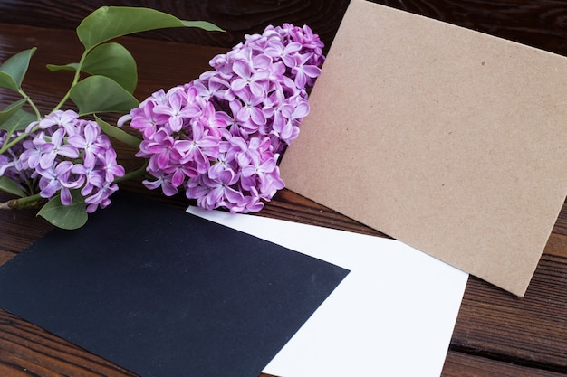 Syringa flowers on wooden table.