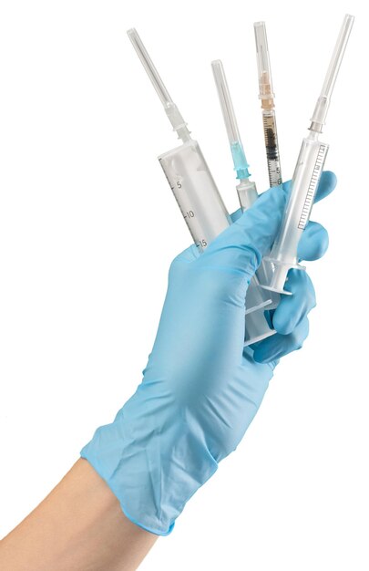 Syringe in hand isolated on white