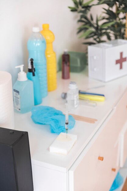 Syringe in the white sponge on cabinet in the clinic