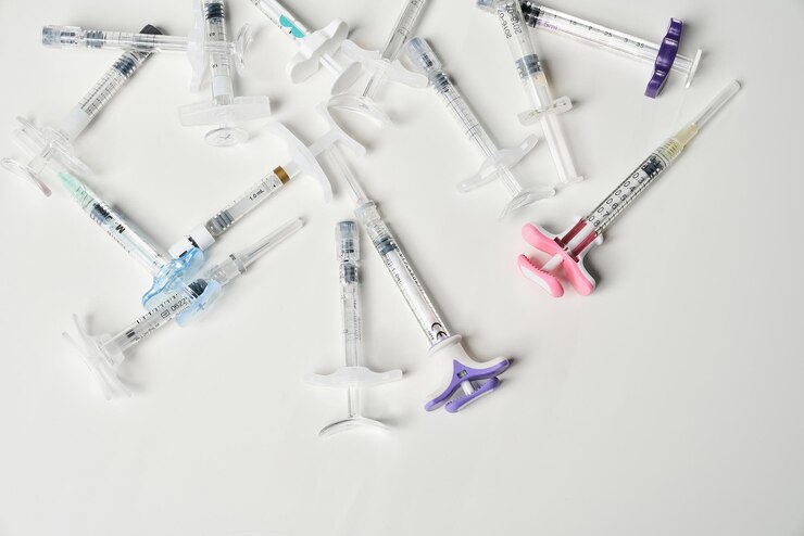 Free Photo syringes filled with liquid inside on white background view from above of multiple hypodermic