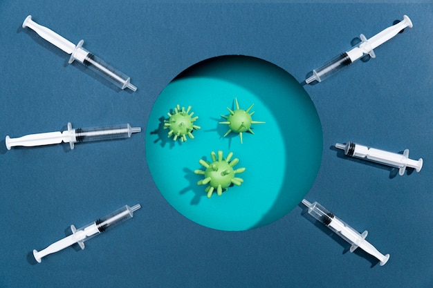 Syringes pointing at bacteria