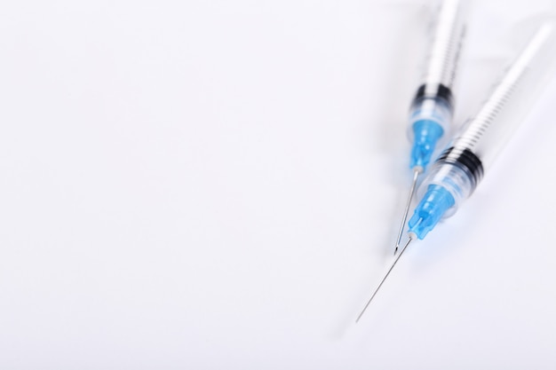 Syringes with blue liquids